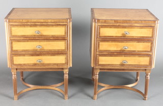 A pair of Empire style satinwood and crossbanded bedside chests of 3 long drawers, raised on turned and reeded supports with Y shaped stretcher 24 1/2"h x 18"w x 16"d 