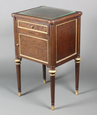 A mahogany Empire style bedside cabinet with gilt banding, fitted a drawer above a cupboard and raised on turned and fluted supports 32"h x 19"w x 17"d 