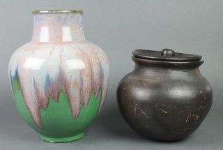 A turquoise slip glazed baluster vase 11" and an Earthenware pot and cover