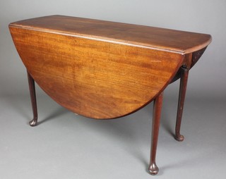 A Georgian mahogany oval drop flap dining table, raised on club supports 28"h x 48"w x 18" when closed x 52 1/2" when fully extended