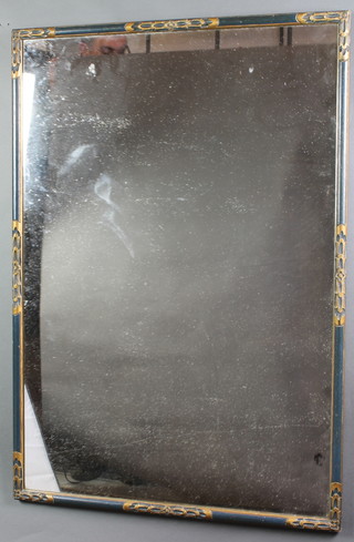 A rectangular plate mirror contained in a green and gilt frame 40" x 28" 