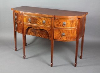A Georgian style mahogany bow front sideboard, fitted 1 long drawer above 1 secret drawer flanked by a pair of bow front cupboards, raised on square tapering supports, spade feet 36"h x 54 1/2"w x 23"d 