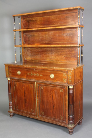 A Regency brass inlaid rosewood chiffonier sideboard, the raised back fitted 2 shelves, the base with drawer above cupboard enclosed by panelled doors and with column decoration to the side, inlaid brass throughout 71"h x 51"w x 16"d 