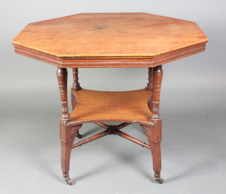 An Edwardian Art Nouveau octagonal walnut 2 tier occasional table with shaped undertier and X framed stretcher, raised on turned reeded supports 29"h x 35"w x 35"d 