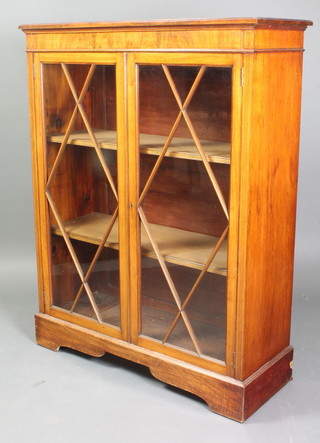 A Georgian style mahogany display cabinet, fitted shelves enclosed by astragal glazed panelled doors, raised on a platform base 48"h x 37"w x 14"d 