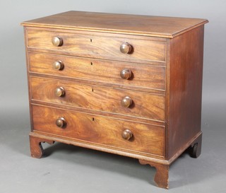 A 19th Century mahogany chest of 4 long drawers with brass escutcheons, raised on bracket feet 35"h x 40"w x 21 1/2"d 