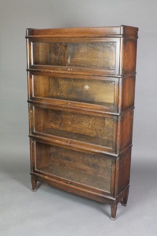 An oak 4 tier Globe Wernicke bookcase, raised on square tapering supports 58"h x 34"w x 12"d 