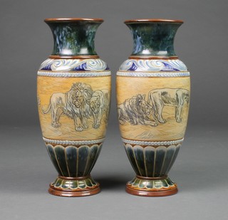 Hannah Barlow A pair of Doulton Lambeth oviform vases with blue scroll ground and green decoration, incised with lions and lionesses 13" 