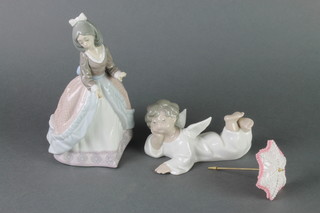 A Lladro figure of a reclining angel 5 1/4", a ditto lady with a parasol. 5210 8" 