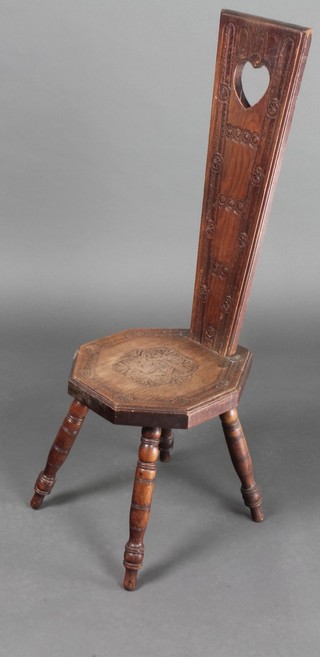 A carved oak spinning chair 
