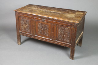 An 18th/19th Century carved oak coffer of panelled construction with hinged lid 23"h x 41"w x 16"d 