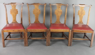 A set of 4 19th Century oak Chippendale style slat back dining chairs with upholstered drop in seats, raised on square supports 