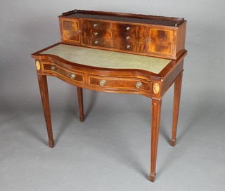 A Georgian style mahogany writing table, the back with raised superstructure with three-quarter gallery fitted 6 short drawers, flanked by a pair of cupboards above a green leather writing surface, the base fitted 2 long drawers, raised on square tapering supports, spade feet 37"h x 36"w x 20"d 