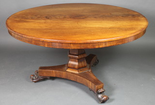 A William IV circular mahogany breakfast table raised on a chamfered column and triform base with scroll feet 28"h x 64" diam. 