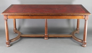 A 19th Century rectangular oak library table with inset tooled writing surface, fitted 2 long drawers, raised on Doric turned columns and with Y shaped stretcher 30"h x 71"l x 36"w 