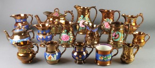 A quantity of Victorian lustre ware comprising a teapot, a breakfast teapot, a mug and 13 jugs 