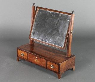 A 19th Century rectangular plate dressing table mirror with swing frame, raised on a rectangular base fitted 1 long and 2 short drawers with ivory escutcheons (1f), raised on bracket feet 21"h x 20 1/2"w x 8 1/2"d