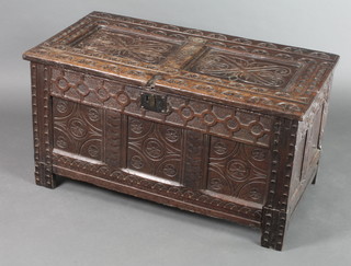 An 18th Century carved oak coffer of panelled construction with hinged lid 20 1/2"h x 38"w x 20"d 
