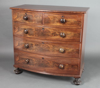 A 19th Century mahogany bow front chest of 2 short and 3 long drawers with tore handles, raised on bun feet 41"h x 41 1/2"w x 23 1/2"d 