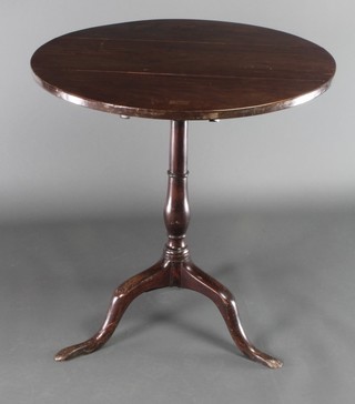 A 19th Century circular mahogany snap top wine table, raised on turned column and tripod base  28"h x 26 1/2" diam. 