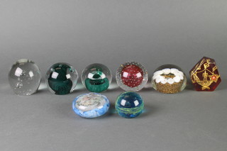 A collection of 8 modern glass paperweights 