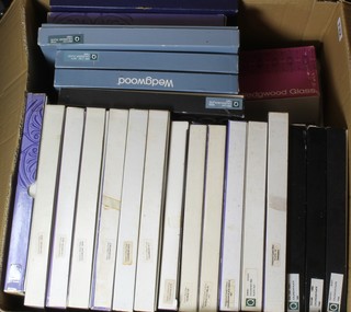 A collection of 22 Wedgwood decorative wall plates, boxed