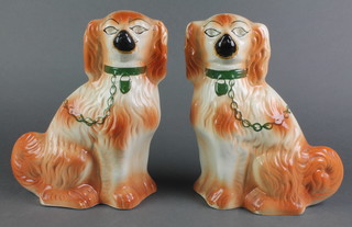 A pair of late Victorian Staffordshire Spaniels with typical padlock and chain decoration 13" 