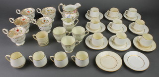 An Edwardian cream and gilt part coffee set comprising 12 coffee cups, 11 saucers and a cream jug together with a quantity of minor tea and coffee ware