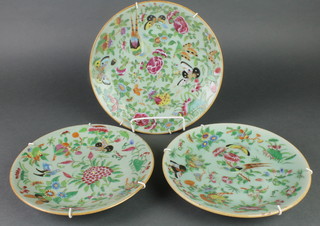A pair of Celadon plates decorated with birds amongst flowers 8 1/2", a ditto 9 1/2" 