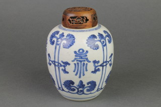 A 19th Century Chinese blue and white baluster jar decorated with stylised flowers, with hardwood lid 6" 