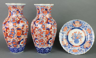 A pair of 19th Century Imari fluted oviform vases decorated with flowers 12", a ditto plate 7" 