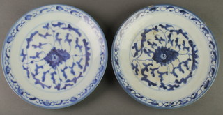 A pair of 19th Century Chinese blue and white provincial dishes decorated with stylised scrolling flowers 7 1/2" 