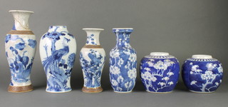 A blue and white prunus ginger jar, 1 other, 2 crackle glazed vases and 2 blue and white vases 