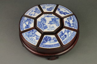 A modern Chinese hardwood 9 section hors d'oeuvres set with blue and white porcelain lids 10" 