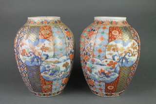 A pair of good 19th Century Imari ribbed vases with panels of extensive landscapes and trees 10" 