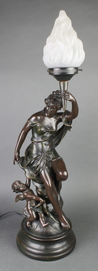 An Art Nouveau style bronzed table lamp in the form of a classical lady holding a torch with cherub in attendance 31"h (hand f and r)