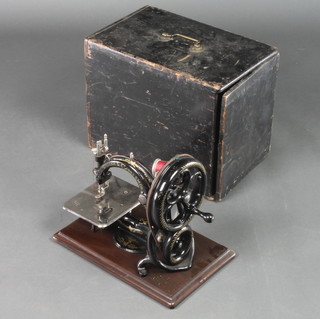 Willcox & Gibbs, a manual sewing machine complete with wooden case 