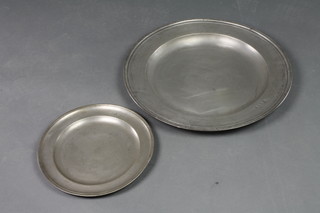 An 18th Century circular pewter charger 20" together with a circular pewter plate marked AS 12" 