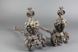 A pair of 19th Century French iron and gilt metal fire dogs decorated cherubs 