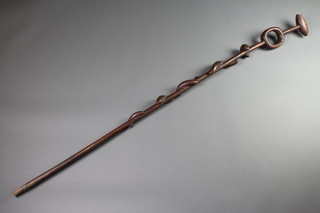 An African hardwood stick, the shaft decorated 2 "serpents" 