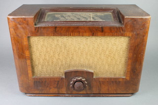 A Philips no.4418 radio contained in an oak case 