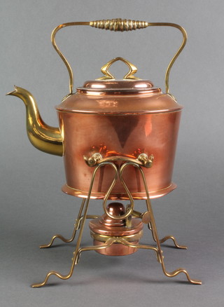 An Art Nouveau Continental copper and brass spirit kettle complete with burner, the base marked Muster Gesetlegesch  