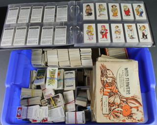 An album of cigarette cards and a large collection of loose cigarette cards