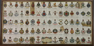 A framed poster, crests and badges of the British Army 10" x 20", some creasing and sellotape repairs 