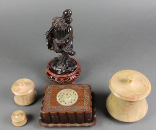 3 graduated turned and waisted marble jars and covers 4", 2" and 1", a rectangular Chinese hardwood box set a hardstone panel 5", a carved figure of a standing Deity 7", 2 hardwood stands 