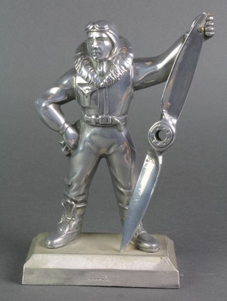 An Art Deco style aluminium table lighter in the form of a standing airman, raised on a rectangular base 9" 