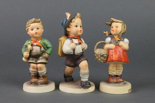 3 Hummel figures - Little Shopper. 96 4 1/2", Schoolboy. 82/0 5" and  Boy with a Bugle. 97 4 1/2" 