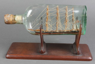 A 19th Century model of a 4 masted merchant ship "Annie" contained in Robert Cain bottle 11" 