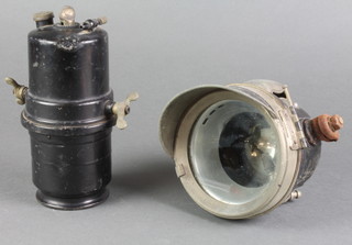 A Lucas King of the Road carbide acetylene motorcycle head lamp generator together with a Desno headlight 