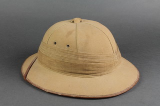 A Hawkes cork pith helmet dated 1937 